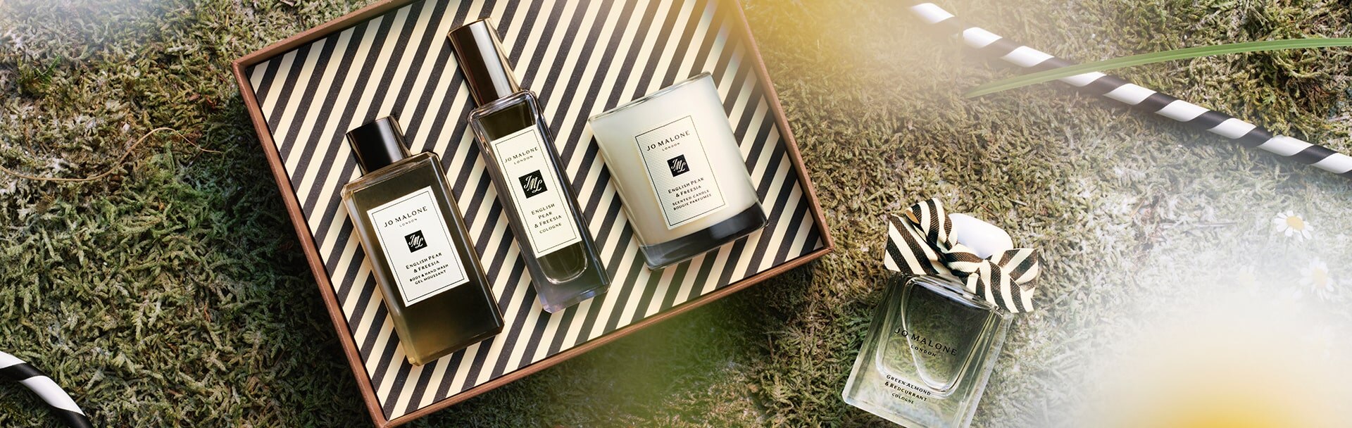 Jo Malone London Gift Set for her on a bed of moss with candle cologne and bath & body products and bows